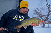 image of Jason Feldner holding Walleye on Devils Lake